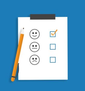 A customer review chart showing a checkpoint next to a smiley face.